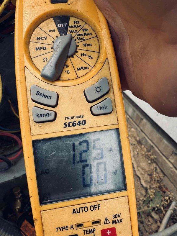 Responded to service call for banging noise occurring in Lennox XC16S036-230A06 air conditioning unit after extended run time. Performed diagnostic inspection and tested electrical components with multimeter to identify source of abnormal sound, which temporarily subsides when system is shut down for several hours before recurring during operation.