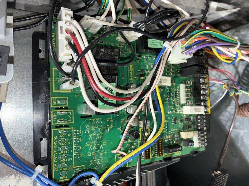 Completed routine cooling maintenance visit on 12-year-old air conditioning system. Performed comprehensive inspection of blower assembly and control board, documenting system condition through detailed photography. All components found operating within normal parameters with minor dust accumulation noted on blower wheel blades; system cleared for continued operation.