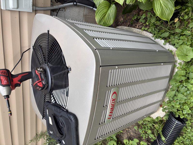 Responded to air conditioning service call for 3-year-old Lennox outdoor condenser unit. Upon arrival, performed comprehensive system inspection including visual examination of electrical connections, contactor assembly, and wiring terminals. Inspected condenser fan motor operation and verified proper electrical connections at terminal block. Checked refrigerant line connections and assessed overall unit condition. All electrical connections were secure, wiring showed proper configuration with appropriate color-coded conductors connected to terminals. Unit operational at time of inspection with no immediate failures detected.