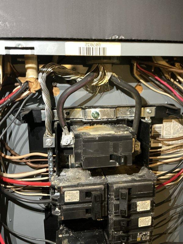 Responded to loss of power in garage. Upon inspection, found electrical panel with significant water damage and corrosion on interior base plate and breaker assembly. Heavy rust-colored oxidation present throughout lower section of panel, indicating historical moisture intrusion. Multiple circuit breakers showed signs of deterioration, dust accumulation, and compromised connections. Identified corroded breaker serving garage circuit as primary cause of power failure. Due to extent of water damage affecting panel integrity and safety concerns with corroded components, recommended full panel replacement to restore safe electrical service and prevent future failures.
