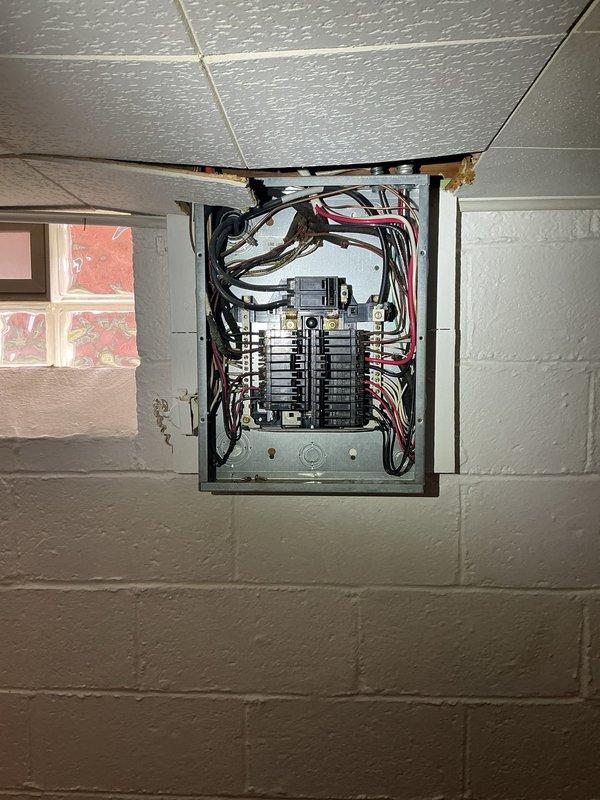 Completed electrical service upgrade including trenching and installation of new sub panel in detached garage with proper grounding via new ground rod. Replaced five undersized circuit breakers identified by red wire connections in main panel to meet current code requirements. All work performed to meet inspection standards with permit obtained for project compliance.