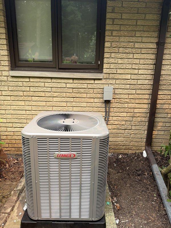# HVAC Install - Complete System

Completed full residential HVAC system installation including an 80% efficiency furnace, central air conditioning unit, whole-home humidifier, and air scrubber system. Installed new Lennox outdoor condensing unit on mounting pad against exterior brick wall with proper clearances for airflow and service access. Mounted electrical disconnect box on exterior wall and ran conduit connection to condensing unit per code requirements.

Inside the home, installed new furnace system with integrated ductwork in attic space. Mounted AprilAire whole-home humidifier with digital control panel on main supply plenum, connected water supply line, and wired control to furnace board for automatic humidity management. Integrated air scrubber system into ductwork for enhanced indoor air quality. Completed all electrical connections including thermostat wiring and system controls. Verified proper refrigerant charge, tested all safety controls, and confirmed system operatio