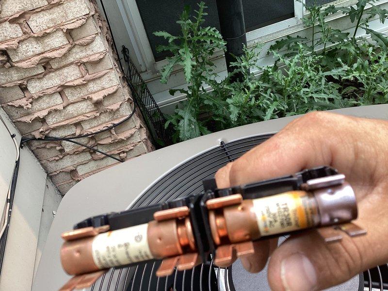 Responded to no-cooling call where outdoor unit failed to start. Upon inspection, discovered blown fuses in disconnect preventing power to condenser. Replaced faulty fuses with new components, restoring power to unit. Verified fan motor operation and confirmed system returned to normal cooling function.