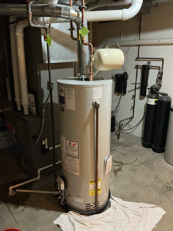Installed a 2.1 gallon expansion tank on a 50-gallon water heater system with 3/4" connection. Parts were ordered and staged with the water heater kit prior to installation, then properly integrated into the existing plumbing system to provide thermal expansion protection and maintain system pressure stability.
