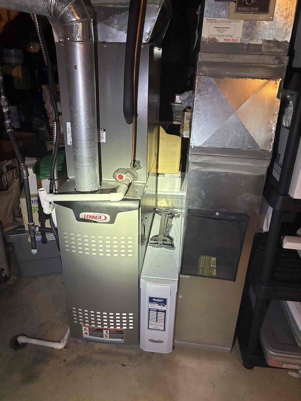 Completed preventive maintenance cooling visit on 7-year-old residential HVAC system. Discovered significant accumulation of grass clippings, plant matter, and debris inside outdoor condensing unit that had built up around electrical components, contactor relay, and wiring. Removed all debris from unit interior to prevent potential electrical issues and ensure proper airflow. Inspected indoor Lennox furnace and air handler system, verified all connections and components functioning properly. Unit restored to optimal operating condition with improved airflow and reduced fire hazard risk from accumulated organic material.