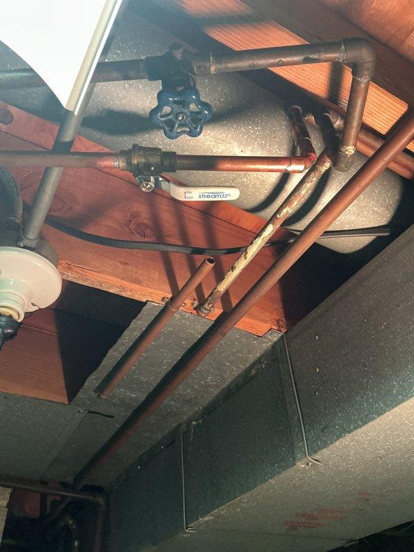 Responded to service call back for damaged gate valve that occurred during previous waterline installation. Upon arrival, inspected the plumbing system in the ceiling space and confirmed the blue-handled gate valve sustained damage when water service was restored. Replaced the faulty gate valve with new unit, ensuring proper connection to existing copper piping. Tested system for leaks and verified full water flow restoration. All connections secured and system returned to normal operation.