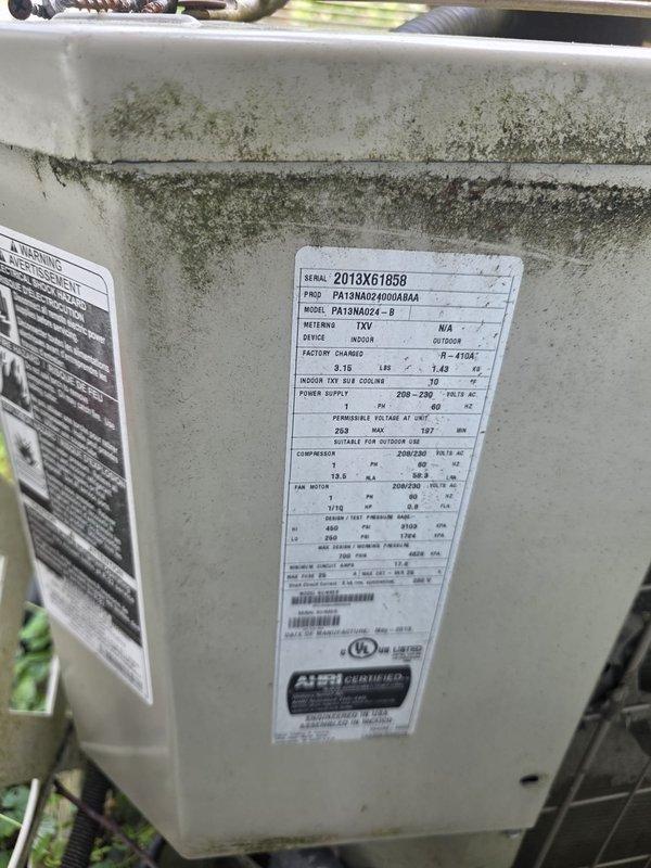 Responded to service call for non-operational central air conditioning system at recently purchased residence. Upon arrival, inspected outdoor condenser unit (Model PA13NA024-B, Serial 2013XG1858) and found unit surrounded by protective wire mesh cage with significant biological growth and mold accumulation on exterior cabinet panels. Performed diagnostic testing to identify cause of system failure, checked electrical connections, verified thermostat communication, and assessed condenser coil condition. Unit required attention due to extended period of inactivity prior to homeowner occupancy. Successfully restored system to operational status and confirmed proper cooling cycle initiation.