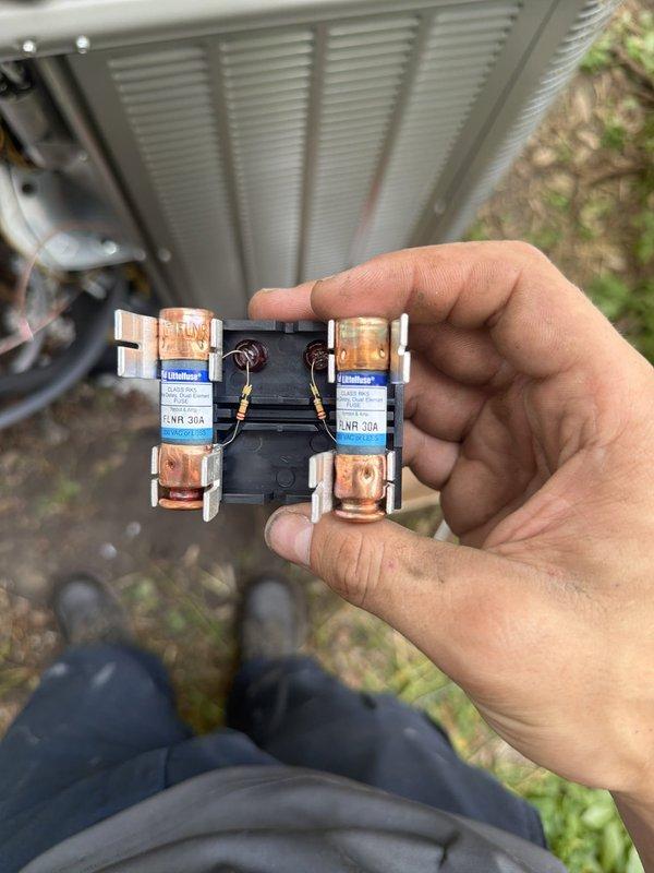 Completed first-time air conditioning and evaporator coil installation. Installed new 30-amp Littelfuse fuse block assembly with proper electrical connections to the outdoor condensing unit. Connected refrigerant line set with brass service valves and fittings to establish proper refrigerant flow between the indoor coil and outdoor unit, ensuring all connections were secure and system-ready for startup.