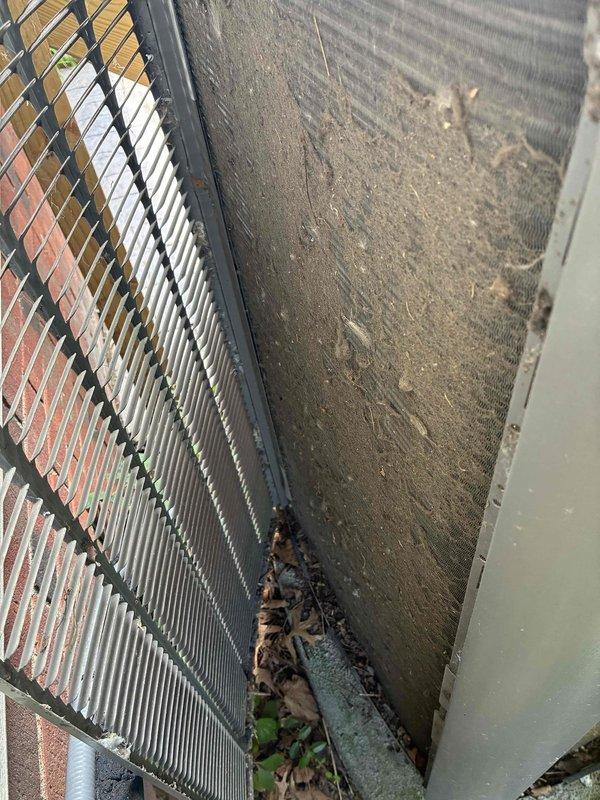 Performed cooling maintenance on an eight-year-old electric air conditioning system with gas furnace setup located in basement. Inspected outdoor condenser unit which showed significant dirt accumulation, debris buildup on coil fins, and algae growth on exterior panels. Addressed customer concern regarding AC failure during power outages and discussed scheduling future heating maintenance.