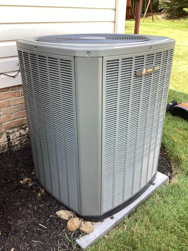 Responded to no cooling call on 11-year-old residential air conditioning system where indoor blower was operating but outdoor condensing unit failed to start. Upon inspection, diagnosed failed dual run capacitor in outdoor unit. Removed defective Genteq capacitor and installed new replacement capacitor with proper microfarad ratings for both compressor and condenser fan motor. Verified all electrical connections were secure, tested system operation, and confirmed outdoor unit now starting properly with normal cooling cycle restored to entire home.