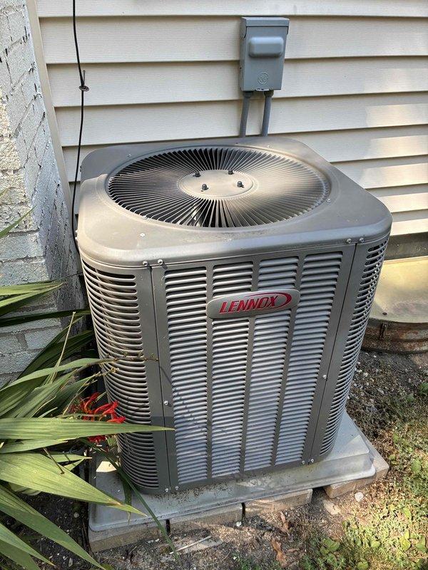 Completed preventive maintenance cooling visit on 7-year-old Lennox residential air conditioning unit. Performed comprehensive system inspection including exterior condensing unit examination, verified electrical connections and components within control panel, inspected capacitor and contactor operation, and documented equipment condition through photographic records. Unit found operating within normal parameters with all electrical connections secure and components functioning properly.