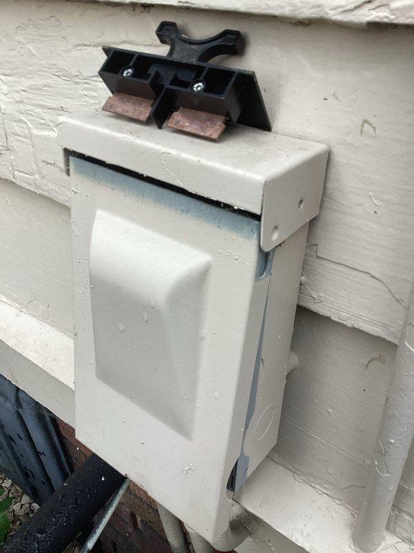 Responded to no-cool complaint on 27-year-old residential AC system with ice formation on refrigerant lines and inadequate airflow to upper level. Upon inspection, found heavy condensation on suction line and evaporator coil frozen due to severely restricted airflow. Diagnosed frozen evaporator coil caused by dirty air filter and blocked return air pathways. Shut down system to allow complete ice melt, replaced clogged air filter, and cleared obstructed return air grilles. Verified blower motor operation and capacitor readings within acceptable range. After defrost cycle completion, restarted system and confirmed proper airflow restoration with suction line temperature returning to normal operating range. Advised customer that while immediate cooling function has been restored, the advanced age of the 1999 unit warrants consideration for replacement due to declining efficiency and increasing likelihood of compressor or other major component failure. Documented exterior disconnect box c