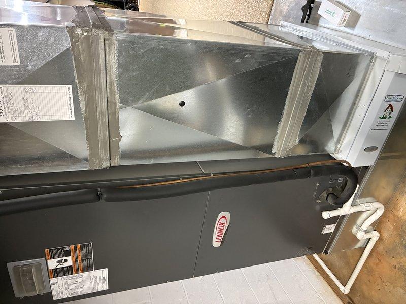 Completed scheduled cooling maintenance visit on a 9-year-old Lennox air handling unit. Inspected system components, documented equipment condition with photos showing clean operational status of the unit and plenum assembly, and noted moderate dust accumulation on the pleated air filter requiring attention during this preventive maintenance service.