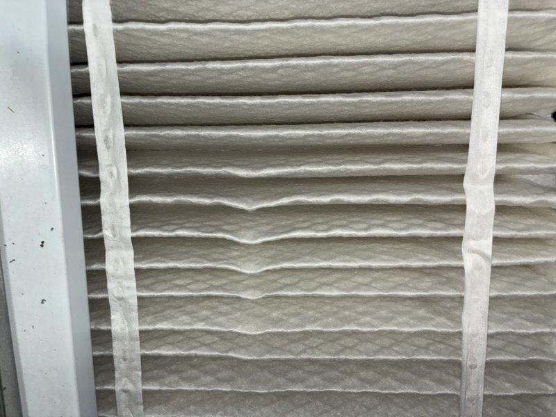 Completed scheduled cooling maintenance visit on a 9-year-old Lennox air handling unit. Inspected system components, documented equipment condition with photos showing clean operational status of the unit and plenum assembly, and noted moderate dust accumulation on the pleated air filter requiring attention during this preventive maintenance service.
