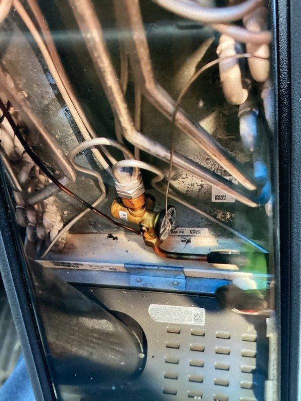 Completed preventive maintenance cooling visit on 2-year-old HVAC system. Inspected refrigerant lines, electrical connections, and heat exchanger coils; all components found in normal operating condition with minor dust accumulation noted on interior surfaces and coil fins. System operating within manufacturer specifications.