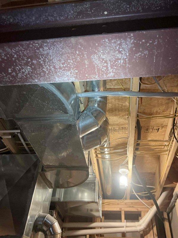 Conducted on-site assessment for whole home generator installation at residential property. Evaluated existing electrical infrastructure in basement area, documented current conditions including HVAC ductwork routing, structural framing, and available utility pathways for future generator integration. Photographed unfinished basement space to identify optimal placement for transfer switch installation and necessary electrical panel modifications to accommodate automatic standby generator system.