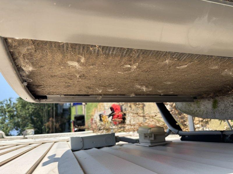 # HVAC Maintenance - Cooling

Completed preventive maintenance cooling visit on a 7-year-old heat pump system. Upon arrival, found extensive debris accumulation on condenser unit top surface and coil area, with thick buildup of dirt, dried leaves, and organic matter significantly obstructing airflow. Unit also exhibited substantial dust and fibrous material coating on underside components and internal surfaces, indicating extended period without cleaning.

Performed thorough inspection and cleaning of outdoor condenser unit. Removed heavy debris layer from top surface and coil sections to restore proper air circulation. Cleaned accumulated dust and contaminants from underside housing and internal components. Verified refrigerant line connections and condensate drain system during service. Assessed overall unit condition and confirmed system operational status following maintenance procedures.

System returned to proper working condition with improved airflow capacity. Documented equipm
