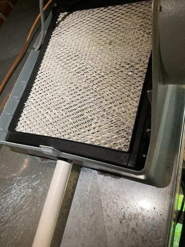 Completed MVP cooling maintenance visit on 2-year-old system. Inspected indoor air handler and found heavily soiled air filter with significant dust and debris accumulation throughout the mesh surface; filter remained structurally intact with visible honeycomb pattern. Accessed outdoor condensing unit and inspected electrical components including capacitor, wiring connections, and control circuits; all components appeared in proper working condition with no visible signs of damage or deterioration.