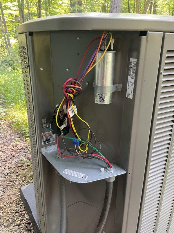 Completed MVP cooling maintenance visit on 2-year-old system. Inspected indoor air handler and found heavily soiled air filter with significant dust and debris accumulation throughout the mesh surface; filter remained structurally intact with visible honeycomb pattern. Accessed outdoor condensing unit and inspected electrical components including capacitor, wiring connections, and control circuits; all components appeared in proper working condition with no visible signs of damage or deterioration.