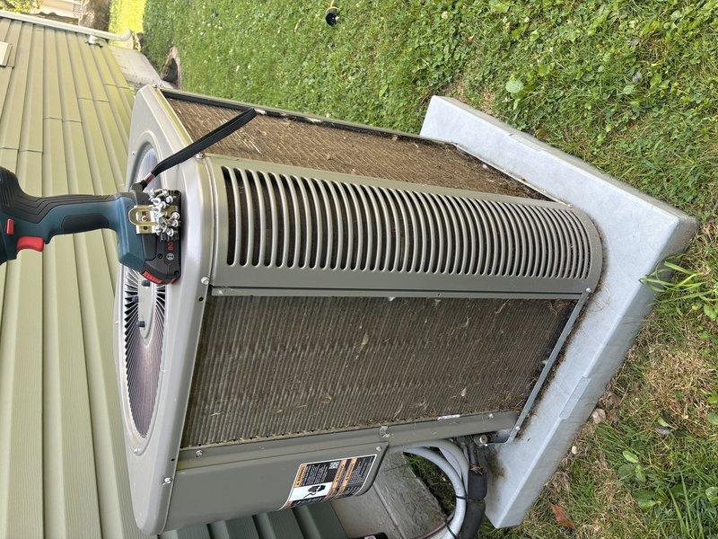 Completed MVP cooling maintenance visit on 3-year-old residential air conditioning system. Performed standard inspection of outdoor condenser unit, noting accumulated dirt and debris on cooling coils and fins. Cleaned condenser coils to restore optimal heat transfer efficiency and airflow capacity, addressing the visible brownish discoloration and buildup that can reduce system performance and increase operating costs. Unit operational and functioning properly upon completion of maintenance service.