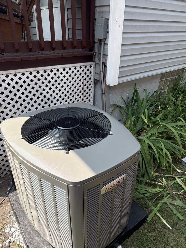 Completed installation of new Lennox air conditioning condenser unit and evaporator coil system. Unit was properly positioned on concrete pad in side yard location, with electrical disconnect and fusing installed per code requirements, all wiring connections secured, and system tested for proper operation.