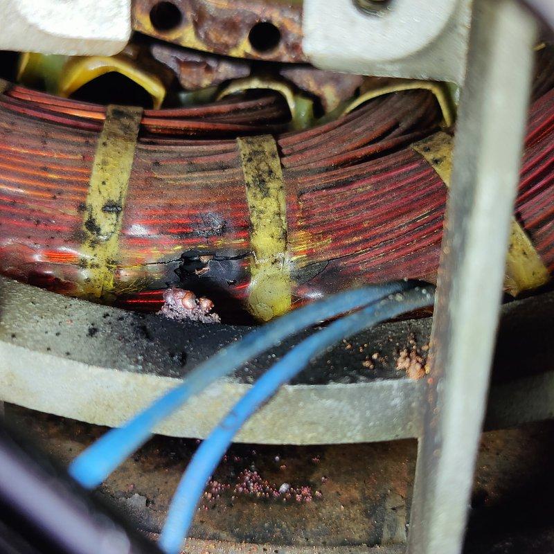 Performed comprehensive diagnostic testing on motor brushes and windings per customer request. Upon inspection, discovered significant thermal damage to motor windings with evidence of overheating, burn marks, and crystallized deposits indicating electrical breakdown. Removed and examined fan impeller assembly, which showed wear patterns and discoloration consistent with motor failure. Conducted electrical continuity testing and resistance measurements on all windings to determine extent of damage. Component exhibited severe deterioration requiring further evaluation beyond initial brush testing scope. Documented all findings with photographic evidence showing damaged copper windings, mounting hardware, and associated components. Advised customer that additional diagnostic work and repairs would be necessary to fully restore equipment to operational condition.
