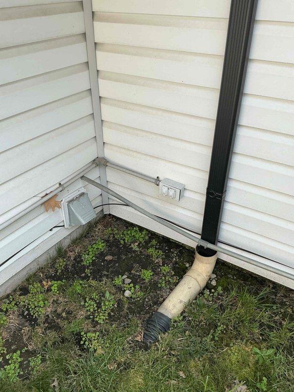 Conducted on-site electrical assessment for 14kW standby generator installation. Evaluated existing utility infrastructure including gas meter, piping connections, and electrical service panel location. Documented current conditions of exterior mounting area, gas line accessibility, and potential equipment placement zones. Assessed foundation clearances, drainage patterns, and utility routing requirements for proper generator installation per manufacturer specifications and local electrical codes.