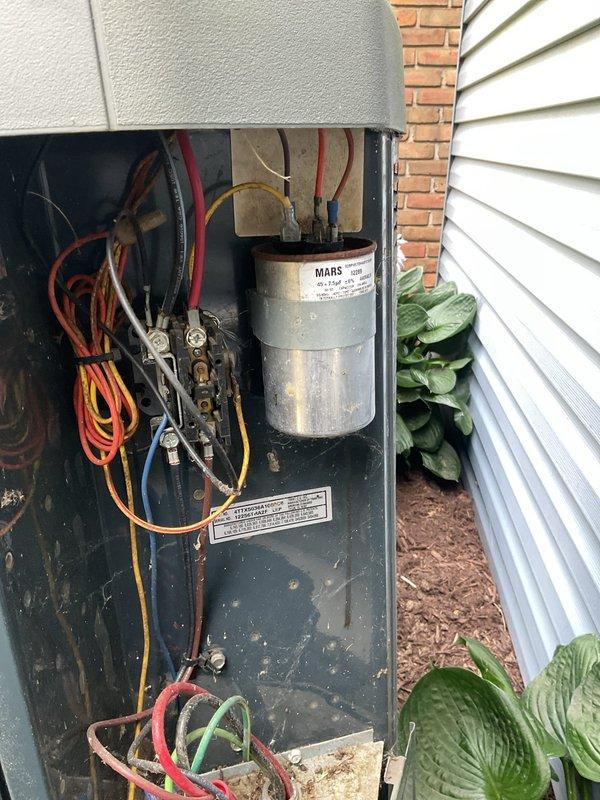 Completed MVP cooling maintenance visit on 13-year-old system. Inspected outdoor disconnect panel and electrical components, including MARS capacitor and associated wiring connections. Verified proper operation of all electrical connections and terminals. Examined exterior utility control box and associated conduit runs. All components found operating within normal parameters for system age.