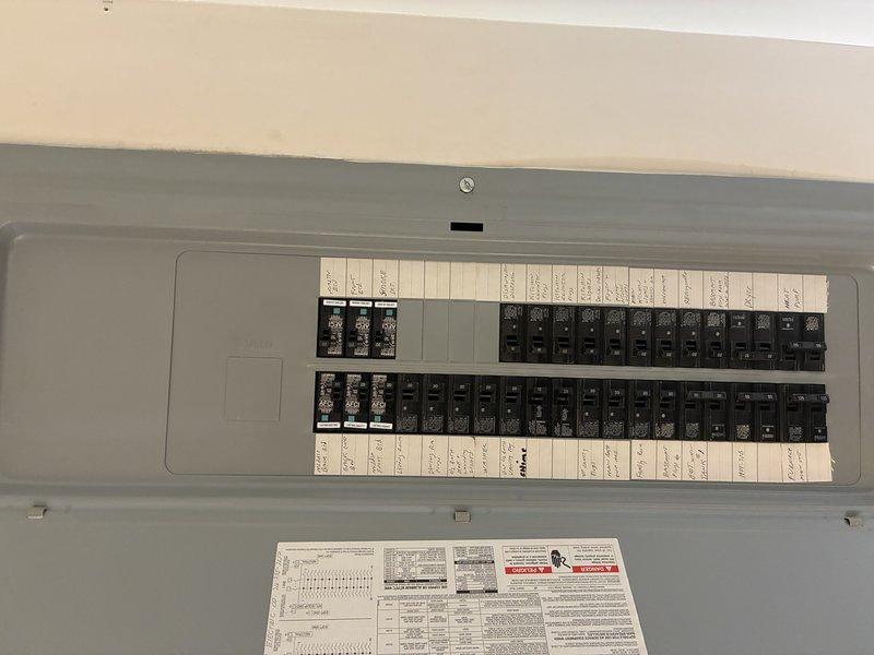 Responded to no-power condition on outside AC unit with tripped breaker that would not reset. Inspected electrical panel and identified tripped breaker serving outdoor condensing unit. Examined outdoor unit components including compressor, refrigerant lines, electrical connections, and condensate management system. Diagnosed short circuit condition preventing breaker reset. Traced fault to compromised wiring at unit connection point. Repaired damaged conductors, verified proper wire routing and connections, and restored secure terminations. Tested system for proper electrical draw and confirmed breaker held under load. Cycled unit multiple times to verify stable operation and proper amperage within manufacturer specifications. System restored to full operational status with no further tripping issues.