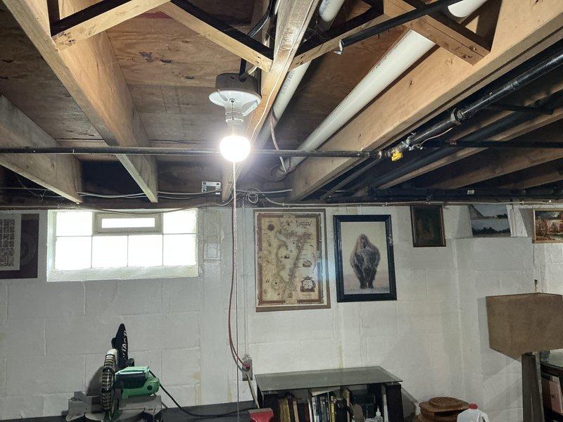 Completed on-site evaluation for furnace and air conditioning system replacement. Assessed existing outdoor condensing unit showing significant age-related deterioration, corrosion on fan assembly, and weathered cabinet condition. Inspected basement installation area with exposed ceiling joists and existing ductwork routing. Provided comprehensive replacement estimate for complete HVAC system upgrade including new furnace and air conditioning equipment.