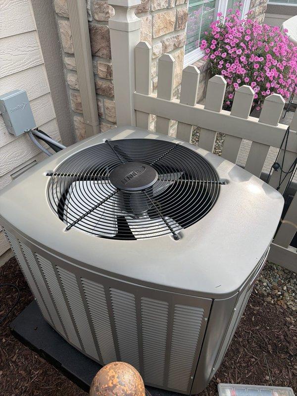 Completed second-phase installation work on residential air conditioning system by installing customer-supplied Nest thermostat. Verified outdoor condensing unit operation, confirmed proper electrical connections including fuse protection, and ensured all components were functioning correctly with new thermostat integration.