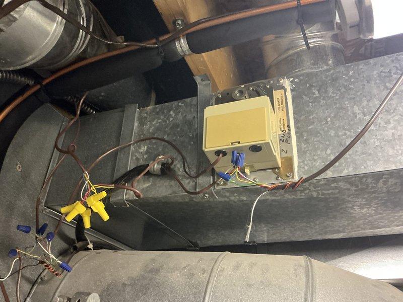 Performed estimate for zoning system in residential attic installation. Upon inspection, determined existing HVAC system and zoning controls are obsolete and require complete replacement. Evaluated two-zone configuration with air handler unit and ductwork distribution system. Documented existing equipment conditions including control board, wiring connections, and duct components through photographic evidence. System assessment indicated full system replacement necessary to restore proper zoning functionality.