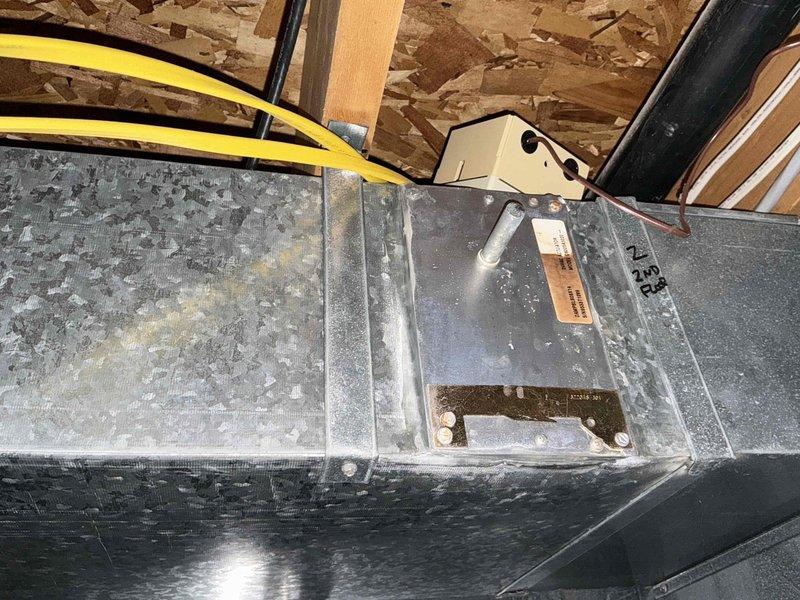 Performed estimate for zoning system in residential attic installation. Upon inspection, determined existing HVAC system and zoning controls are obsolete and require complete replacement. Evaluated two-zone configuration with air handler unit and ductwork distribution system. Documented existing equipment conditions including control board, wiring connections, and duct components through photographic evidence. System assessment indicated full system replacement necessary to restore proper zoning functionality.