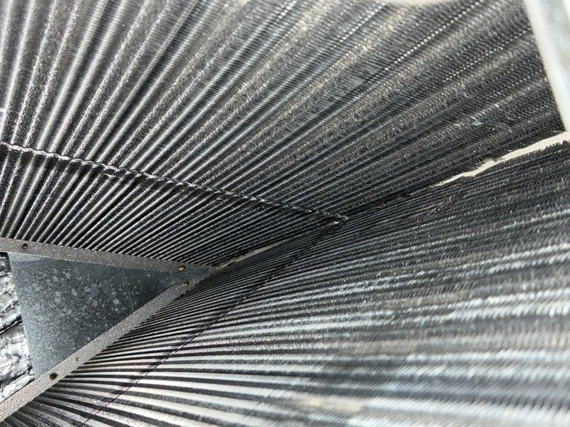 Completed MVP recurring cooling maintenance visit on 5-year-old system. Performed comprehensive inspection of air handler components, including blower wheel assembly and evaporator coil. Documented moderate dust accumulation on blower wheel blades and significant debris buildup on evaporator coil fins, particularly on the air-entering side. System operational at time of service.