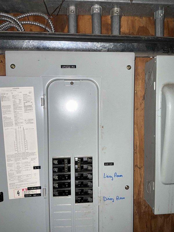 Performed site assessment for complete central air conditioning system replacement at residential property. Existing HVAC system is approximately 40 years old with aging air handler, ductwork, and associated components located in basement mechanical room. Documented current installation including metallic air handler unit with flexible ductwork, copper refrigerant lines, and electrical service panel configuration. Provided comprehensive estimate for new central air conditioning system installation.