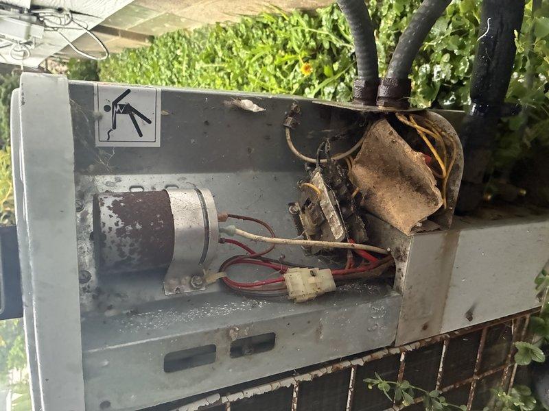 Completed MVP cooling maintenance visit on 35-year-old system. Inspected outdoor condenser unit and internal components, including capacitor and motor assembly. Noted significant dirt accumulation, corrosion, and environmental debris on electrical components and housing due to age and weather exposure. Documented equipment condition with photos showing weathered exterior panels, soiled internal components, and overall system wear consistent with extended service life.