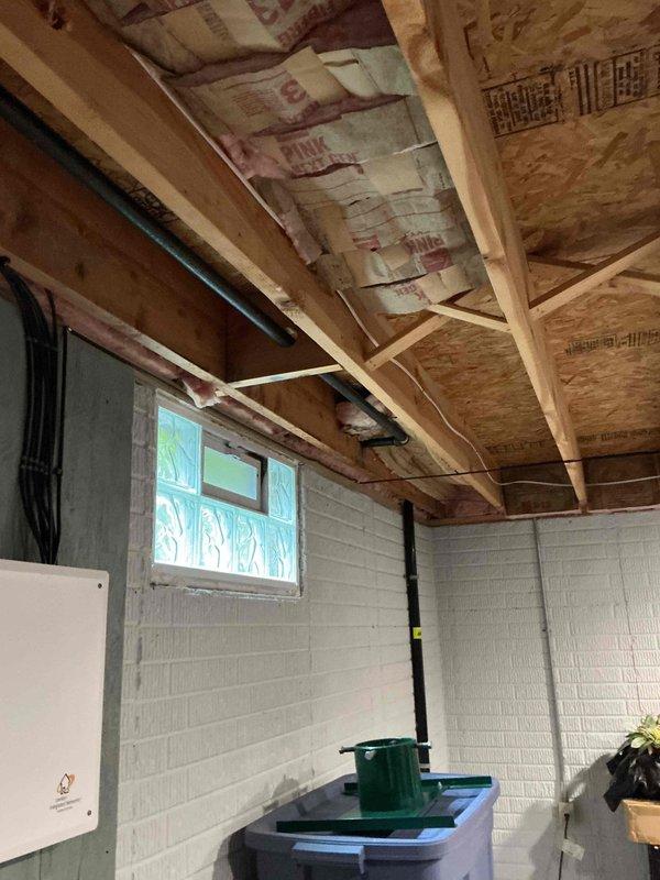 Conducted electrical estimate for generator installation at residential property. Evaluated existing electrical panel configuration and available space in unfinished basement utility area for generator integration. Documented current electrical service capacity, panel layout with multiple circuit breakers, and incoming service wiring to determine compatibility with proposed generator system and transfer switch requirements.
