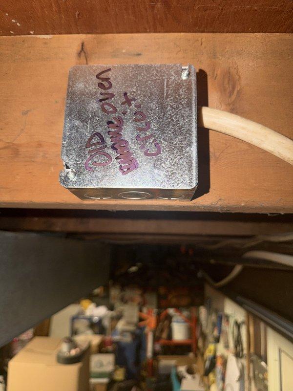 Removed double-stack oven from kitchen cabinet alcove and safely capped off all electrical wiring connections. Installed junction box to house terminated conductors in compliance with electrical code requirements, ensuring all circuits were properly de-energized and secured for future use or permanent disconnection.