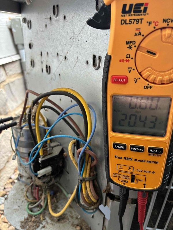 Completed MVP cooling maintenance visit on residential air conditioning system. Performed electrical diagnostics at control panel, measuring 24V control voltage with digital multimeter to verify proper system operation. Inspected outdoor condenser unit, including fan assembly, condenser coils, and electrical disconnect. All components operating within normal parameters and system performing as expected.