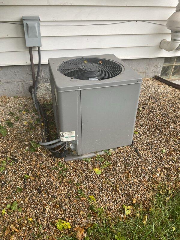 Responded to service call for 16-year-old central air conditioning system experiencing inadequate cooling, weak airflow from vents, and random cycling without reaching setpoint temperature. Upon inspection, found outdoor condensing unit with significant dirt and debris accumulation affecting performance. Cleaned and serviced electrical connections showing weathering and exposure damage, removed debris from unit base and interior components, and verified proper electrical function of contactor and wiring. Addressed airflow restrictions and cyclic operation issues through system diagnostics and component cleaning. Unit tested successfully after service with improved cooling capacity and normal cycling operation restored.