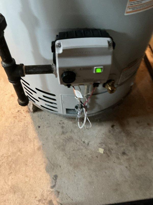 Replaced defective gas control valve and pilot assembly on residential water heater. Parts were covered under manufacturer warranty, and the repair required three hours to complete. New gas control unit was installed and tested, with pilot assembly functioning properly and green indicator light confirming operational status upon completion.
