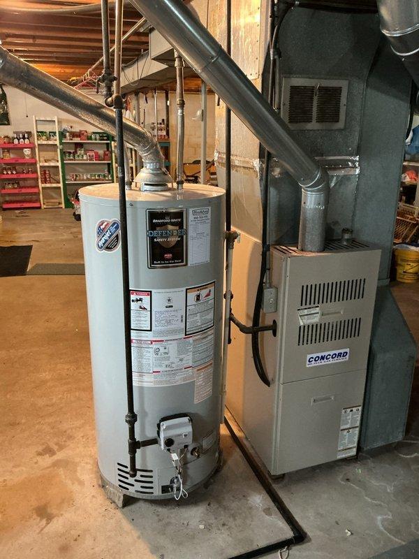 Replaced defective gas control valve and pilot assembly on residential water heater. Parts were covered under manufacturer warranty, and the repair required three hours to complete. New gas control unit was installed and tested, with pilot assembly functioning properly and green indicator light confirming operational status upon completion.