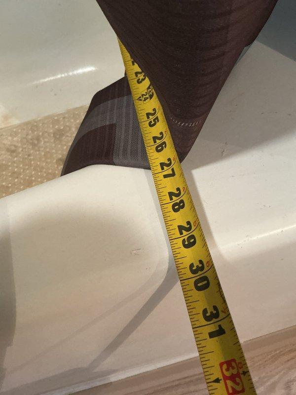 Responded to service call for bathtub replacement assessment and toilet evaluation. Inspected existing bathtub and documented significant deterioration including extensive rust staining around drain area, surface wear throughout porcelain basin, and mildew buildup along caulked seams where tub meets tile surround. Measured existing plumbing rough-in dimensions to determine specifications for new tub installation. Assessed toilet stability as requested and provided recommendations for complete bathroom renovation scope of work.