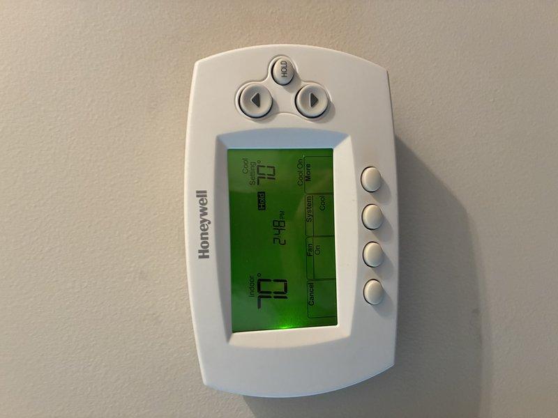Responded to no cooling complaint on second floor of residence with 1-year-old HVAC system. Upon arrival, found thermostat set to 74°F and inspected air filter, which showed moderate dust accumulation and debris buildup. Replaced dirty air filter to restore proper airflow and system efficiency, resolving the cooling issue on the upper level.