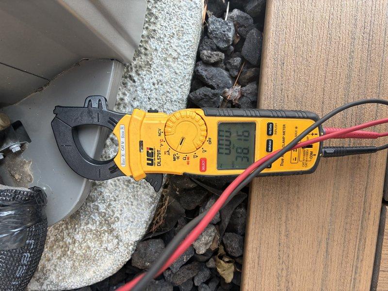 Completed MVP cooling maintenance visit and performed system diagnostics using clamp meter to verify electrical readings and amperage draws. Identified significant frost and crystalline buildup on condenser fan motor housing and fan blade assembly, indicating potential refrigerant charge issues, restricted airflow, or low ambient operation conditions requiring further evaluation and corrective action.