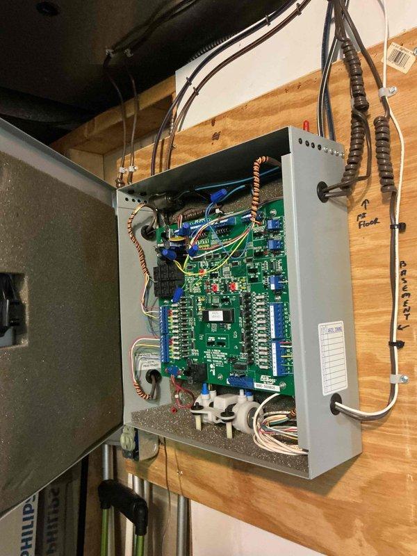 Responded to no cooling complaint with multiple thermostats inoperative. Inspected zone control panel and circuit boards, finding previous battery terminal corrosion issue had recurred affecting system power distribution. Cleaned all thermostat battery terminals, verified proper voltage at zone control board, and restored functionality to all three zone thermostats. System tested successfully with all zones operating normally and recommended thermostat replacement due to age and recurring corrosion issues to prevent future failures.
