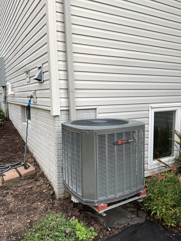 Completed scheduled MVP cooling maintenance visit on residential air conditioning system. Performed comprehensive inspection of outdoor condenser unit, verified proper operation of all components, and documented equipment condition through photographs. Unit found in good working order with adequate airflow through louvers, clean coil surfaces, and proper clearance from surrounding landscaping.