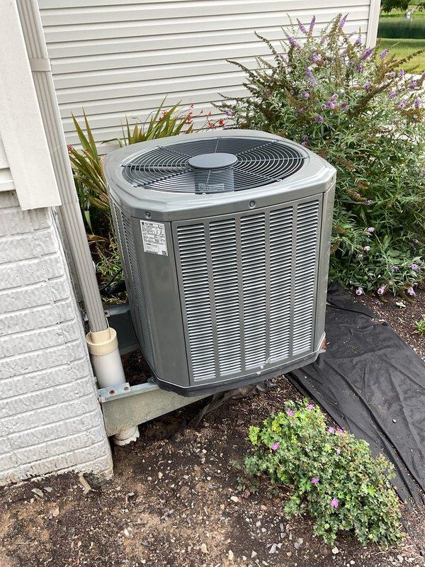 Completed scheduled MVP cooling maintenance visit on residential air conditioning system. Performed comprehensive inspection of outdoor condenser unit, verified proper operation of all components, and documented equipment condition through photographs. Unit found in good working order with adequate airflow through louvers, clean coil surfaces, and proper clearance from surrounding landscaping.
