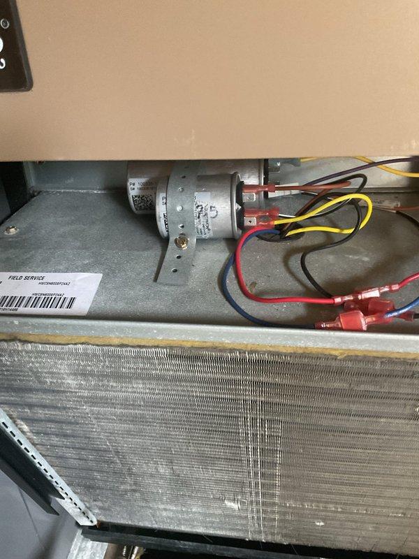 Completed MVP cooling maintenance visit on Magic-Pak packaged HVAC system. Performed inspection of evaporator coil assembly, heat exchanger, and interior components including blower motor and capacitor. Verified all electrical connections and wiring terminals were secure, documented system condition with photos, and confirmed unit operational status per maintenance protocol.