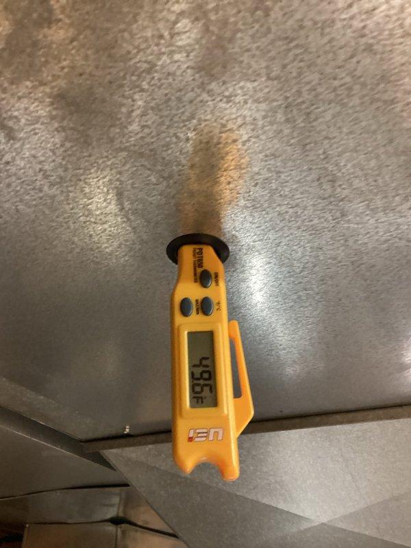 Completed scheduled MVP cooling maintenance visit. Inspected and verified air filter condition in HVAC system, finding filter in acceptable operating condition with minimal dust accumulation. Performed temperature diagnostics using calibrated digital thermometer, recording supply air temperature of 93.6°F at register to verify system cooling performance and proper operation.